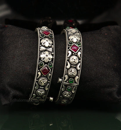 Sterling silver vintage pink stone bangle bracelet with tribal design, stylish jewelry piece with intricate craftsmanship.