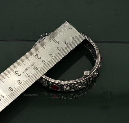 Sterling silver vintage pink stone bangle bracelet with tribal design, stylish jewelry piece from TRIBAL ORNAMENTS.