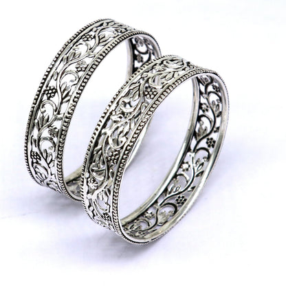 Sterling silver wide floral bangle bracelet with intricate ethnic design, customizable jewelry from TRIBAL ORNAMENTS.