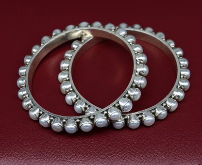 Elegant 925 sterling silver pearl bangle bracelet with oxidized finish, featuring intricate design, ideal for brides and special gifts.