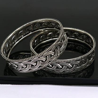 Sterling silver floral-style tribal bangle bracelet by TRIBAL ORNAMENTS, showcasing intricate design for brides and tribal fashion.