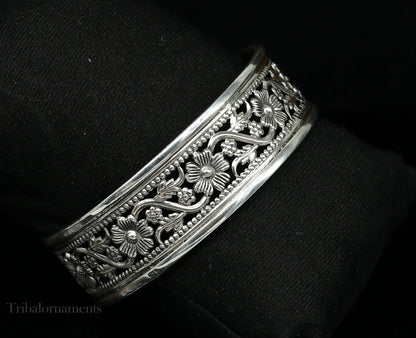 Sterling silver floral-style bangle bracelet by TRIBAL ORNAMENTS, showcasing ethnic tribal jewelry with intricate floral design.