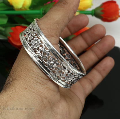 Sterling silver floral-style bangle bracelet by TRIBAL ORNAMENTS, showcasing intricate tribal and ethnic jewelry design.