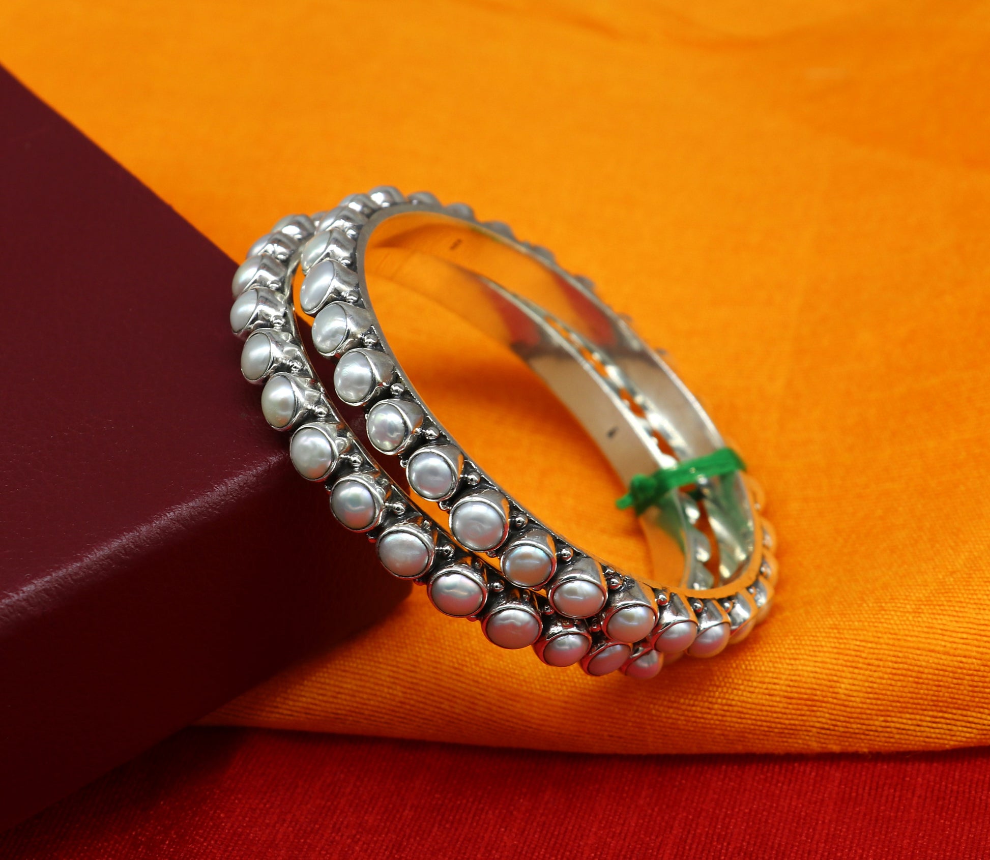Sterling silver Waved design pearl bangle bracelet with oxidized finish, ideal for brides, by TRIBAL ORNAMENTS.