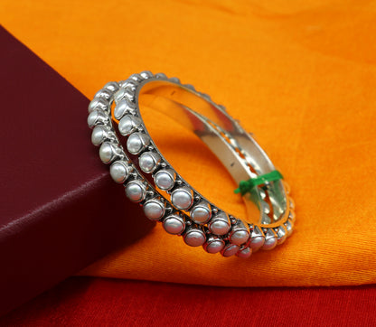 Sterling silver Waved design pearl bangle bracelet with oxidized finish, ideal for brides, by TRIBAL ORNAMENTS.