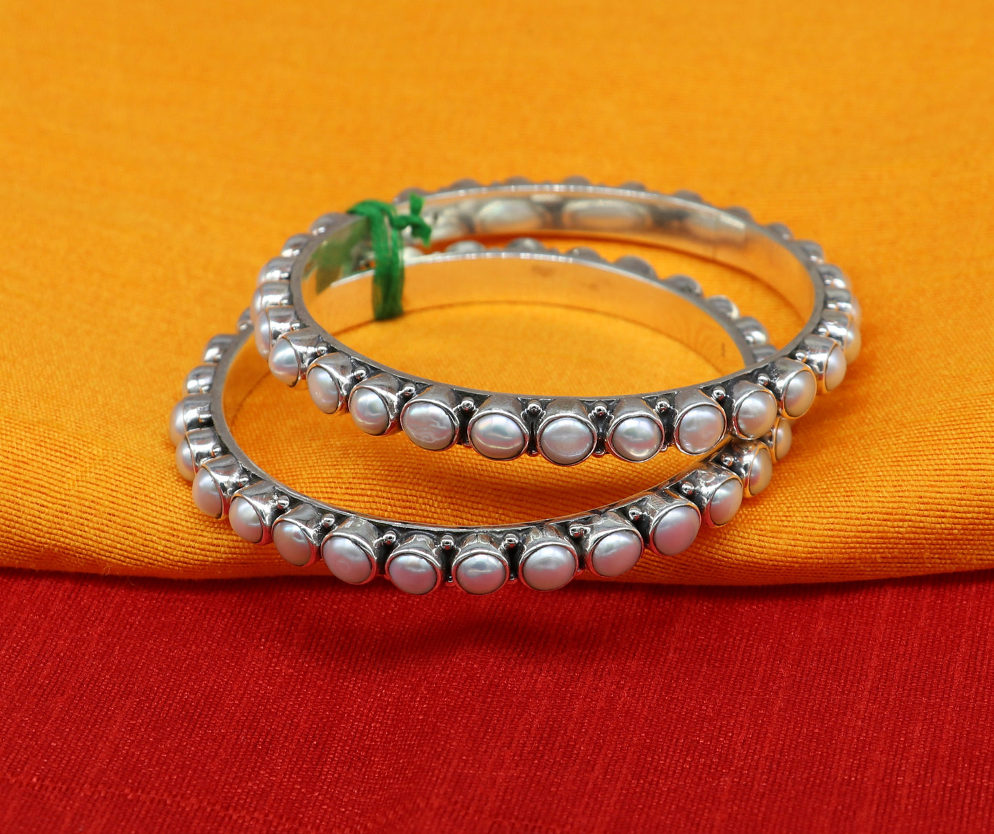 Sterling silver Waved design pearl bangle bracelet with oxidized finish, perfect for brides or special occasions.