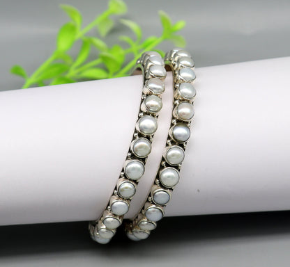 Sterling silver Waved design pearl bangle bracelet with oxidized finish, perfect for brides or special occasions.