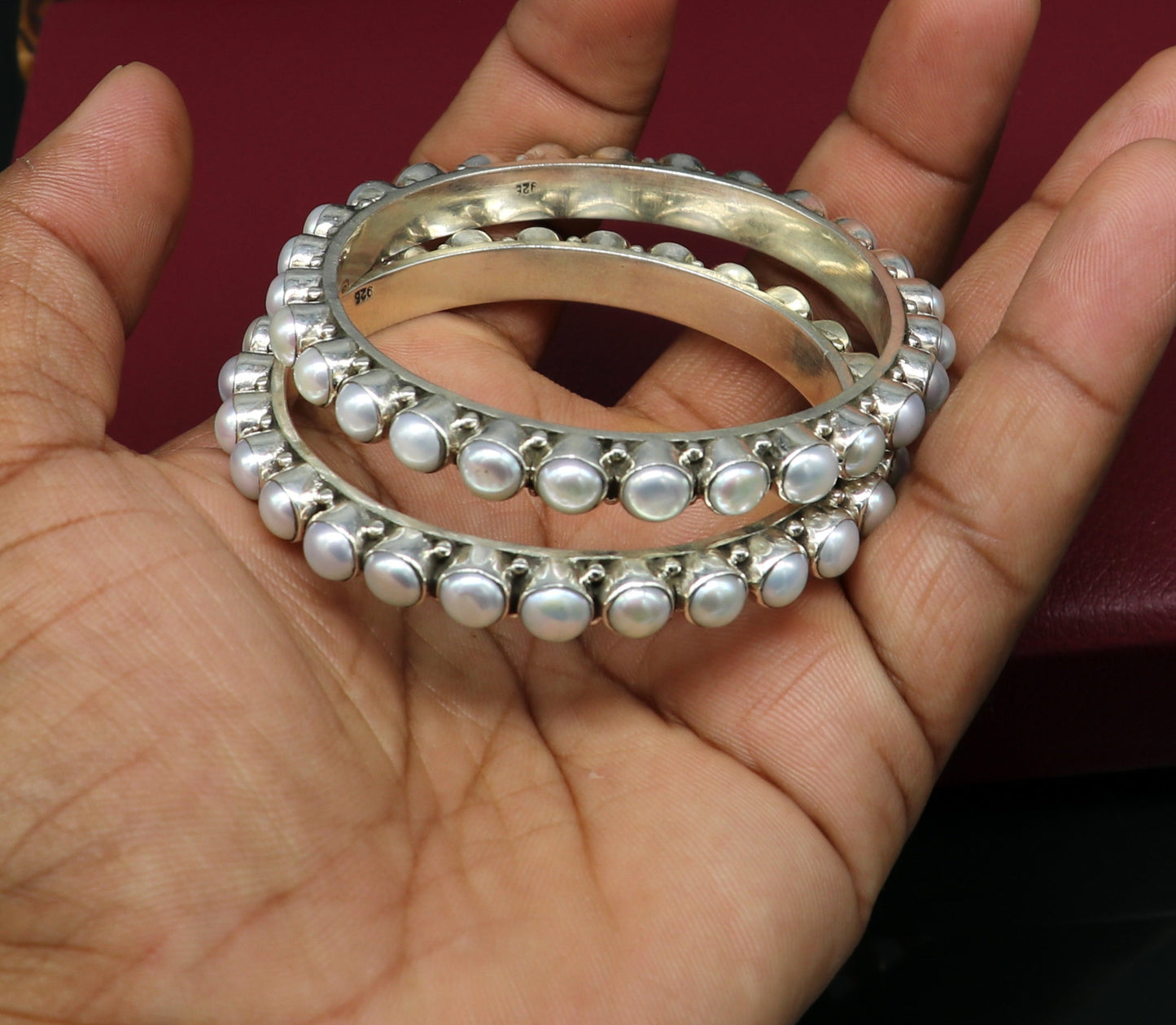 Sterling silver Waved design pearl bangle bracelet with oxidized finish, perfect for brides and special gifting by TRIBAL ORNAMENTS.