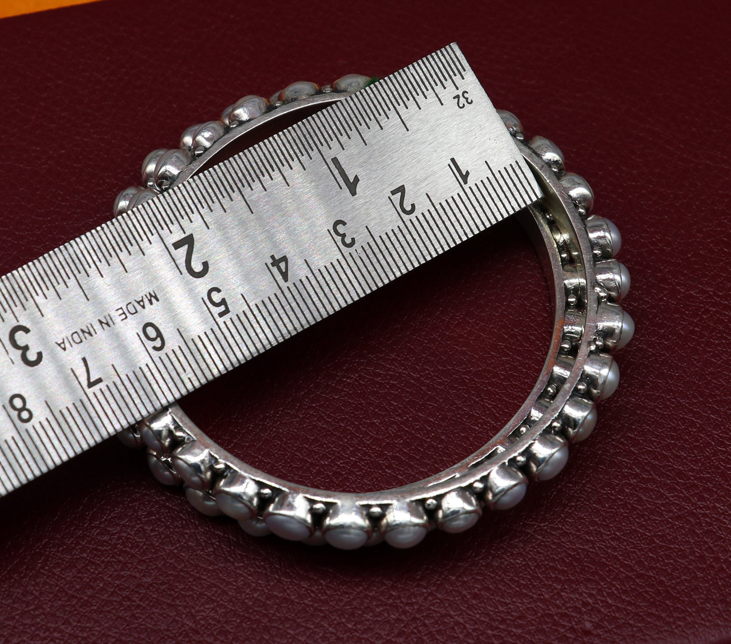 Sterling silver Waved design pearl bangle bracelet with oxidized finish, perfect for brides, by TRIBAL ORNAMENTS.