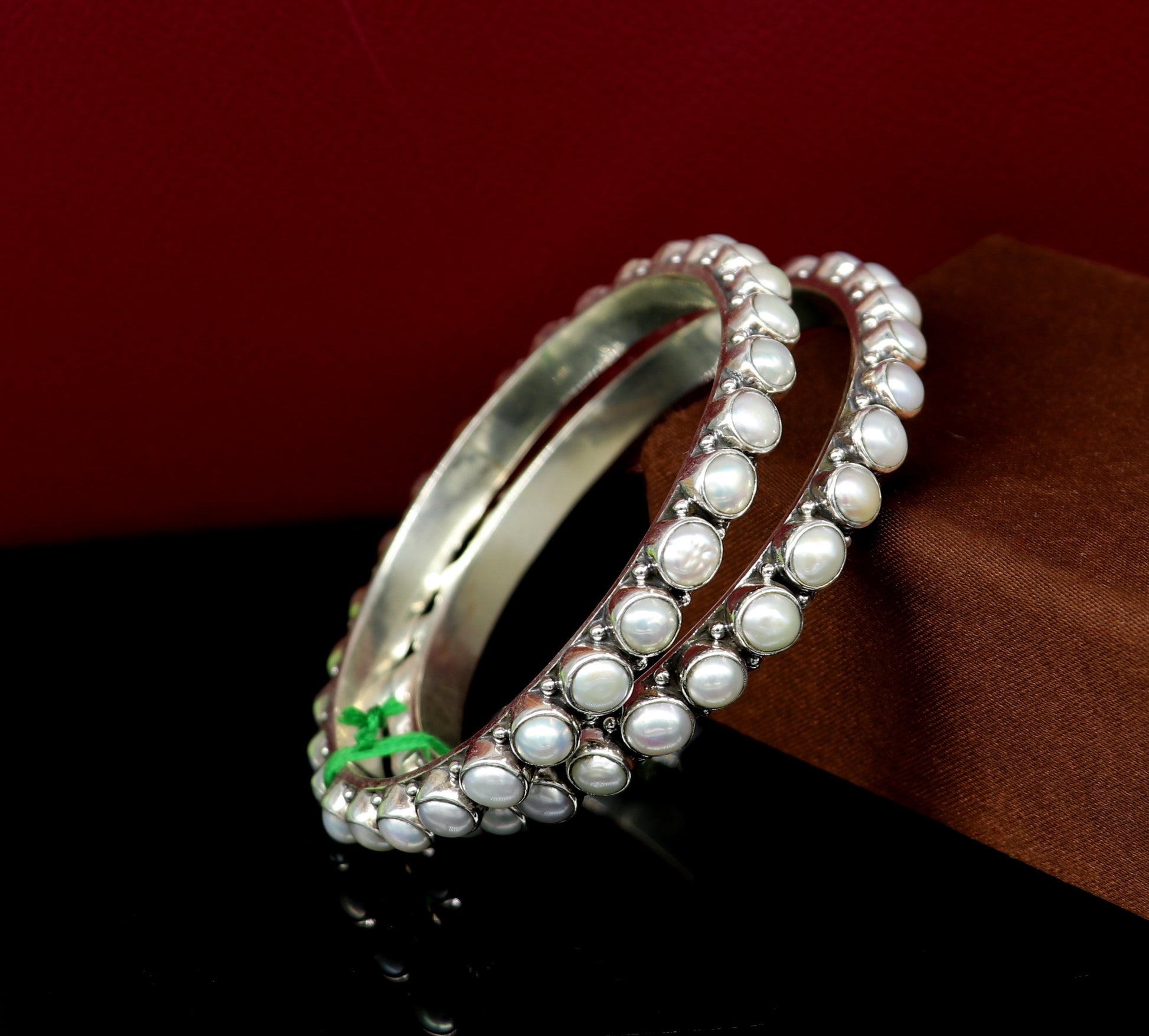Sterling silver Waved design pearl bangle bracelet with oxidized finish, perfect for bridal gifting, by TRIBAL ORNAMENTS.