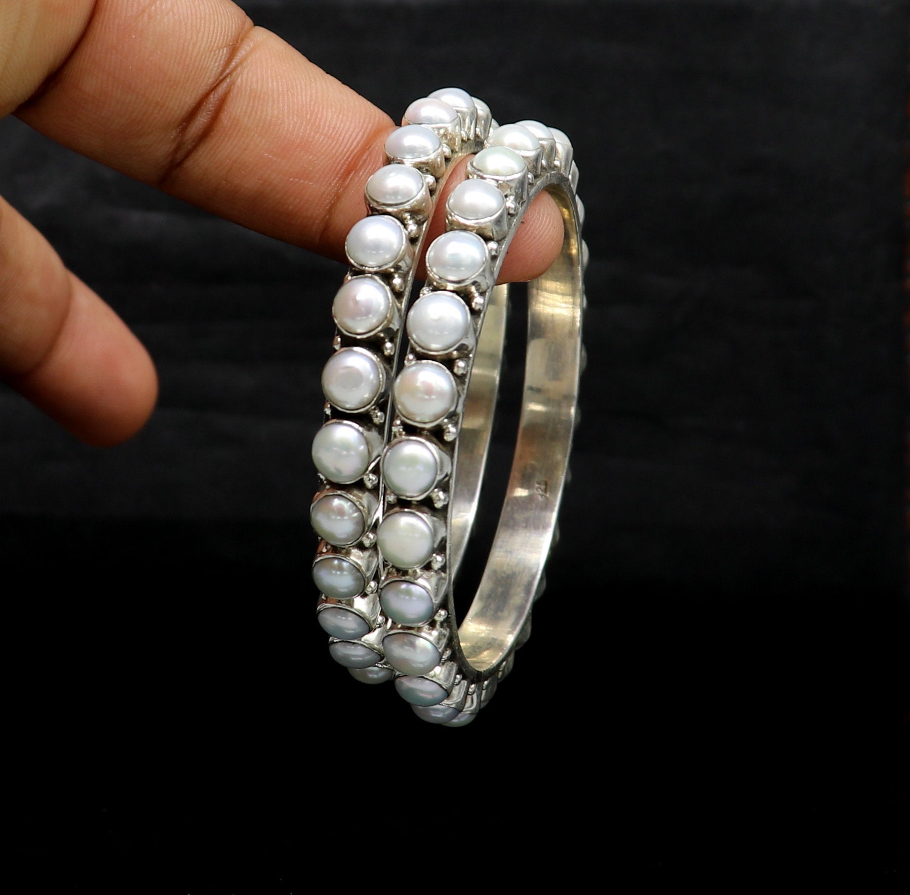 Sterling silver Waved design pearl bangle bracelet with oxidized finish, crafted by TRIBAL ORNAMENTS, ideal for brides or gifting.