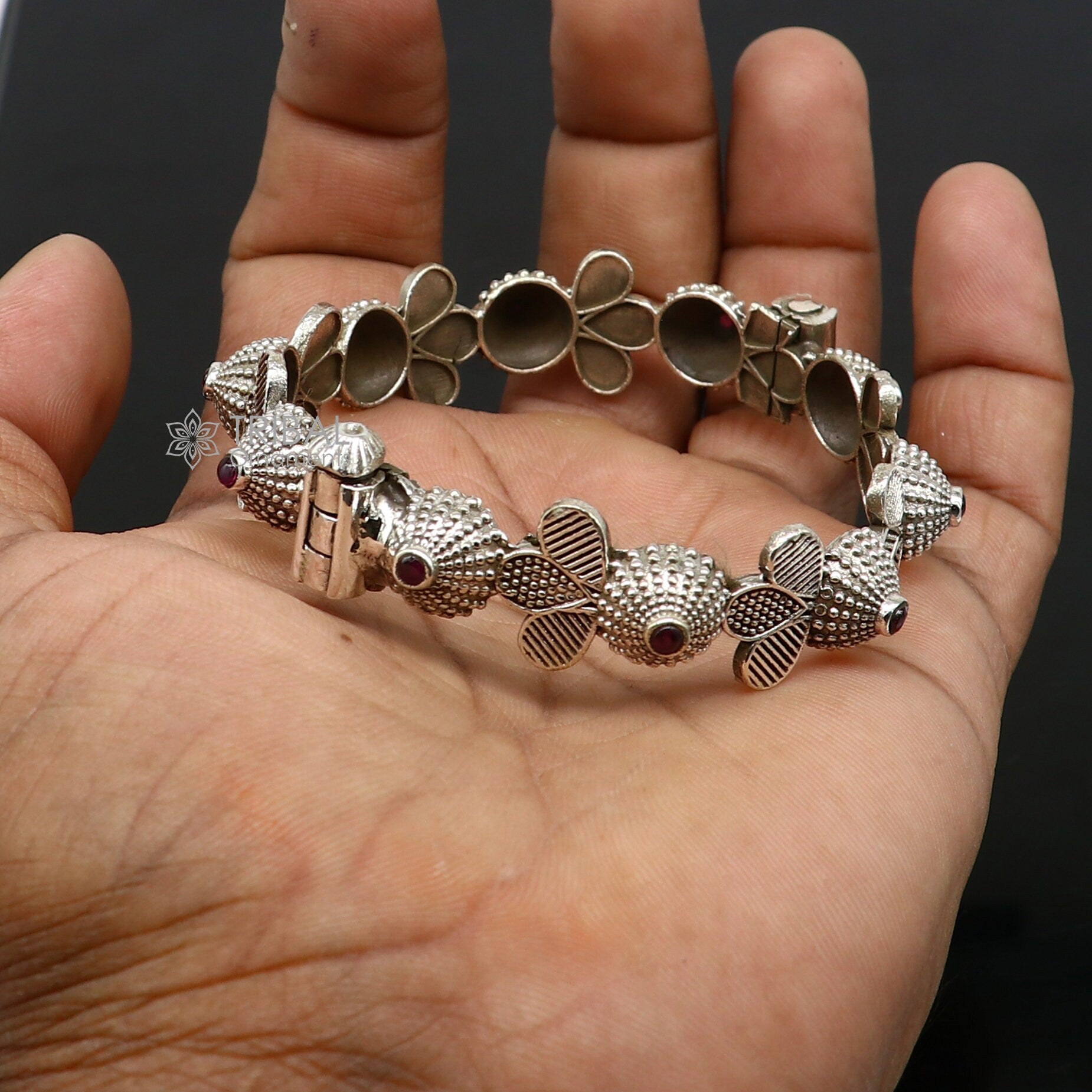 925 sterling silver tribal bangle bracelet with red stone accents, featuring intricate cultural design for wedding or special occasions.