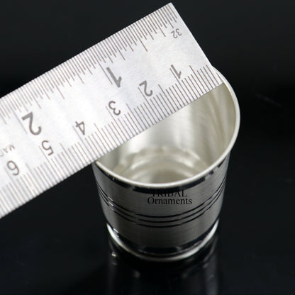 Handmade 999 pure fine silver water and milk cup tumbler by TRIBAL ORNAMENTS, featuring a sleek silver design for dining and gifting.
