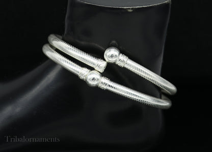 Vintage silver women's ankle kada bracelet featuring hollow tribal design, custom foot jewelry, traditional Indian tribal ornament.