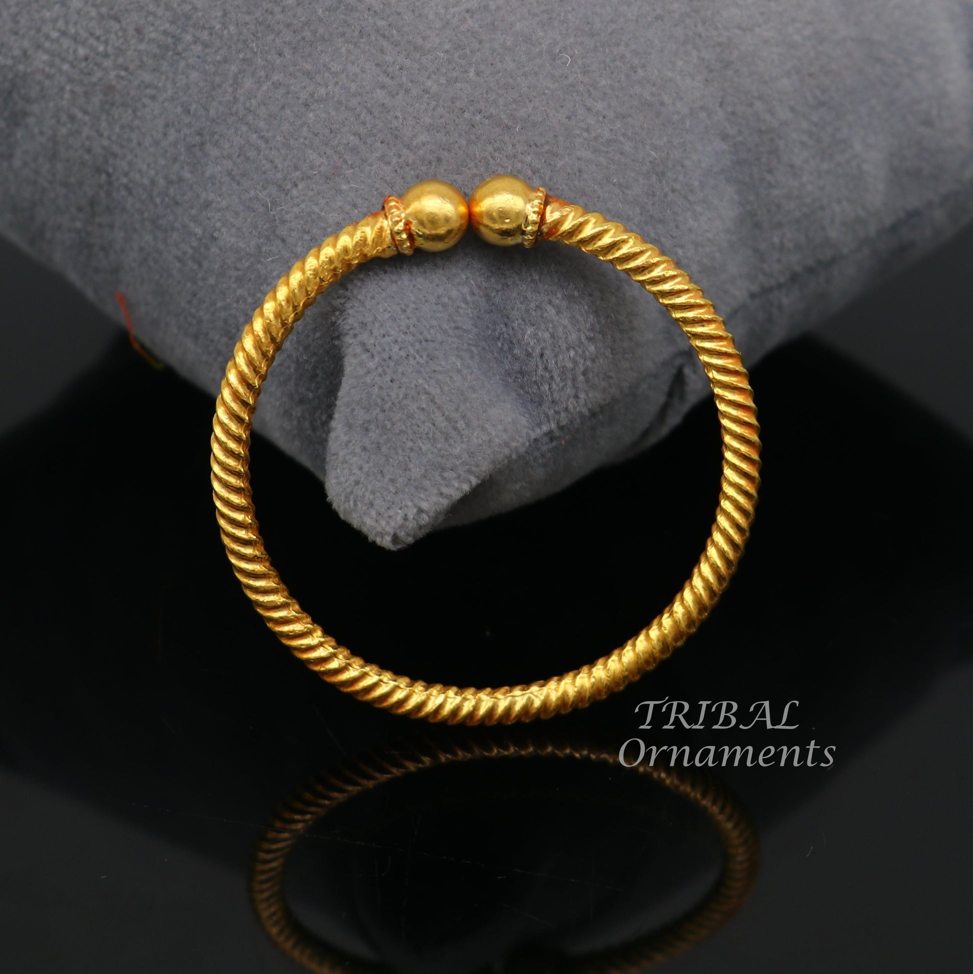 Handmade 22K yellow gold baby bangle with vintage ball face design, hallmarked and certified, by TRIBAL ORNAMENTS.