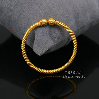 Handmade 22K yellow gold baby bangle with vintage ball face design, hallmarked and certified, by TRIBAL ORNAMENTS.