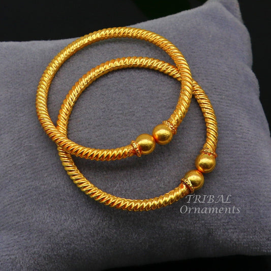 22K yellow gold baby bangle by TRIBAL ORNAMENTS with vintage ball face design, handmade hallmarked jewelry for kids.