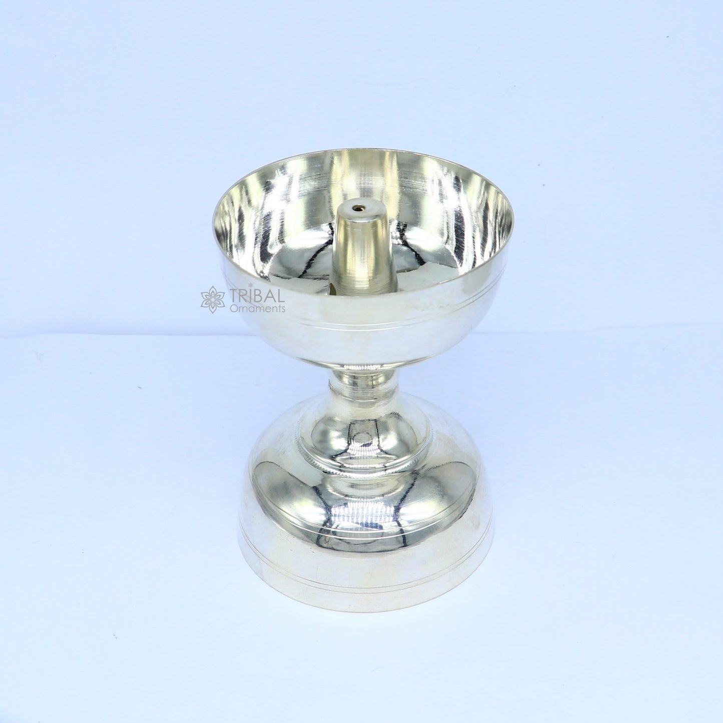 Sterling silver handmade oil lamp with intricate design, used as a home temple diya or puja utensil for spiritual rituals.