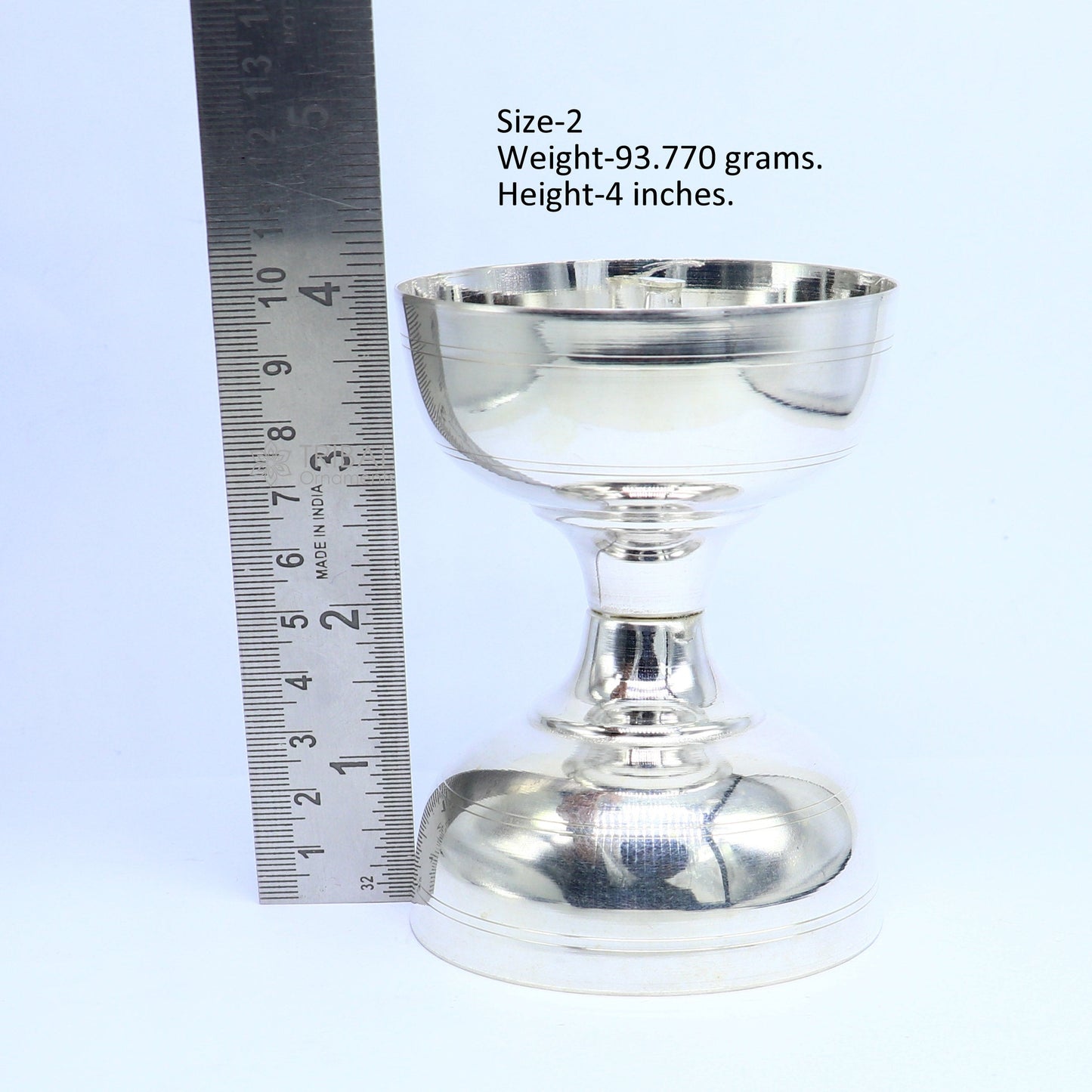 Handmade 925 sterling silver oil lamp with intricate design, used as a silver diya for home temple and puja rituals.