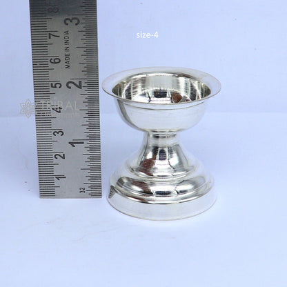 Elegant handmade 925 sterling silver oil lamp with intricate design, ideal for home temple and puja rituals.