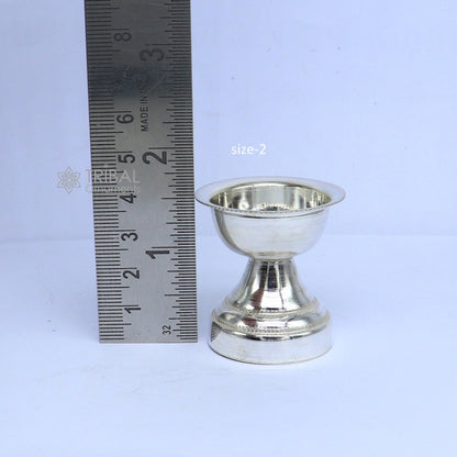 Elegant handmade 925 sterling silver oil lamp with intricate detailing, ideal for home temple puja and decorative use.