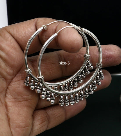Handmade 925 sterling silver hoop earrings from Bali, tribal jewelry with silver hooks, perfect for gifting or stylish accessories.