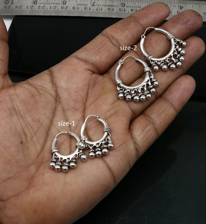 Handmade 925 sterling silver hoop earrings from Bali with silver hooks, showcasing tribal design, perfect for gifting or everyday wear.