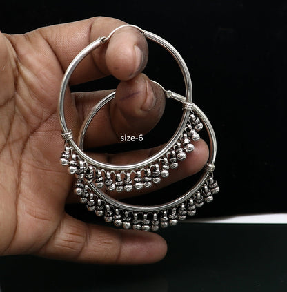 Sterling silver handmade hoop earring by TRIBAL ORNAMENTS, Bali-inspired tribal jewelry with silver hook, perfect for gifting.
