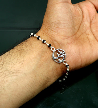 Sterling silver OM design Tulsi beads bracelet with handmade spiritual Aum motif, 6-7 inches, from Tribal Ornaments.