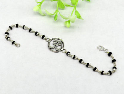 925 Sterling Silver OM bracelet with Tulsi beads, handmade spiritual Rakhi featuring Aum design by Tribal Ornaments.