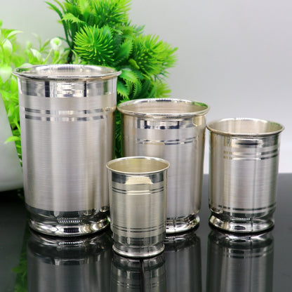 Handmade 999 fine silver water and milk glass tumbler set with matching utensils, ideal for baby food and dining by TRIBAL ORNAMENTS.