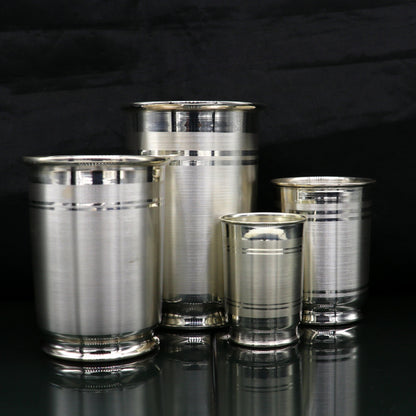 Handmade 999 fine silver water and milk glass tumbler set by TRIBAL ORNAMENTS, includes silver utensils and baby food dining set.