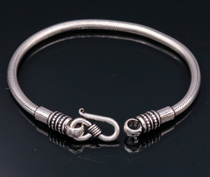 Elegant 4mm 925 sterling silver snake chain bracelet by TRIBALORNAMENT, flexible unisex jewelry with a sleek handmade design.