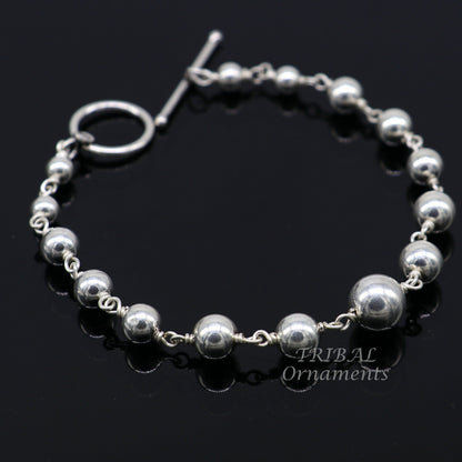 Sterling silver beaded customized bracelet by TRIBALORNAMENT, unisex stylish jewelry with personalized design and intricate bead details.