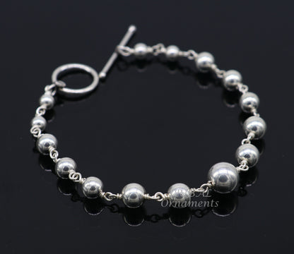 Sterling silver beaded customized bracelet with intricate bead details, unisex stylish jewelry by TRIBALORNAMENT.