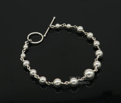 Sterling silver beaded customized bracelet by TRIBALORNAMENT, unisex personalized jewelry with intricate bead details.