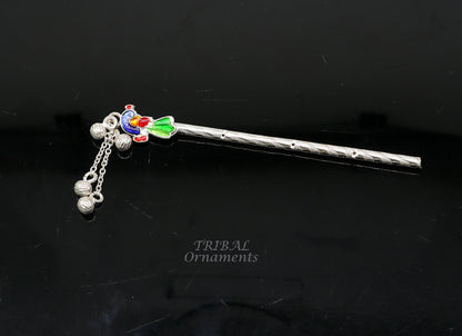 Sterling silver Baby Krishna idol with small flute, handmade jewelry featuring a silver Bansuri and puja art design.