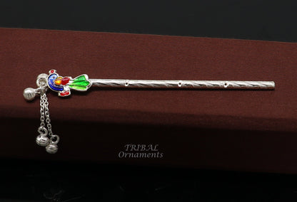 Sterling silver Baby Krishna idol with small flute, handmade jewelry featuring a silver Bansuri and puja art design.