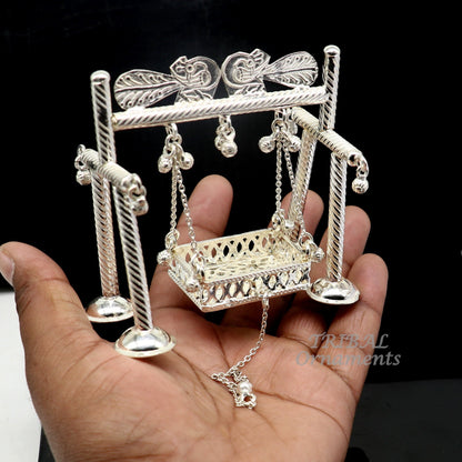 Sterling silver handmade Bal Gopala jhula depicting Little Krishna on a swing, detailed silver art by TribalOrnaments.