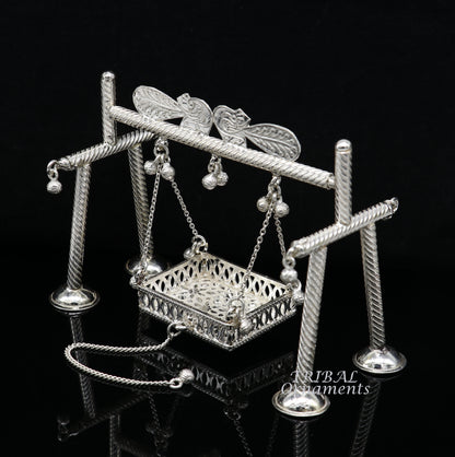 Handmade 925 sterling silver Bal Gopala jhula with Little Krishna swing, intricate silver art, featuring Laddu Gopal design.