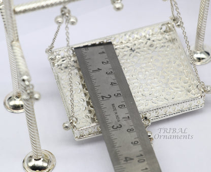 Sterling silver handmade Bal Gopala swing featuring Little Krishna, crafted with intricate silver art and laddu Gopala design.