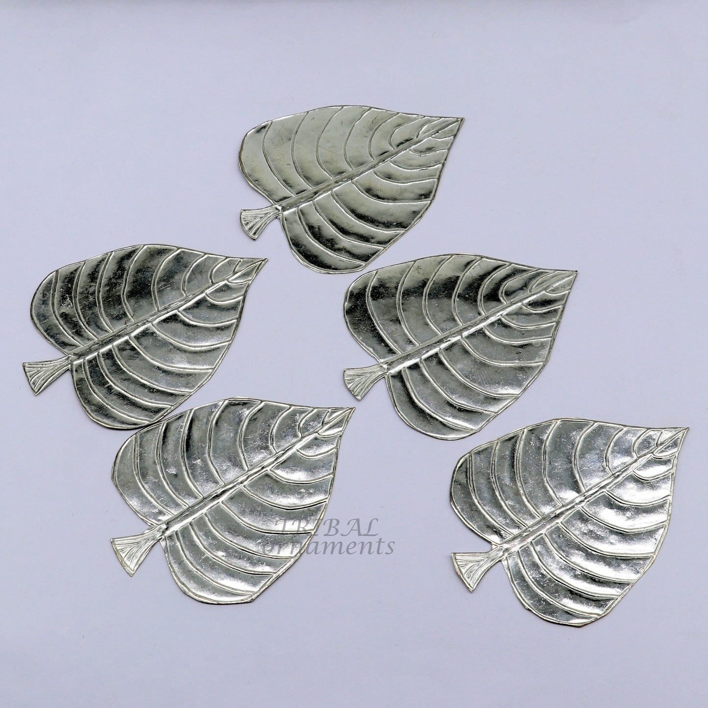 Set of 5 handmade 925 sterling silver pipal leaf puja articles by TribalOrnaments, intricate silver religious decorative pieces.