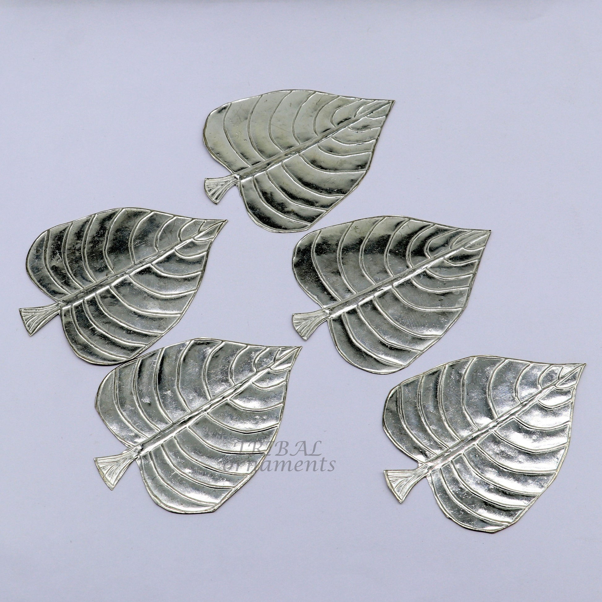 Set of 5 handmade 925 sterling silver pipal leaf puja articles by TribalOrnaments, intricate silver religious decorative pieces.
