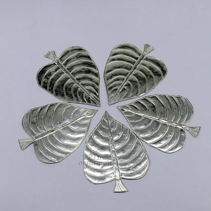Set of 5 handmade 925 sterling silver pipal leaf puja articles by TribalOrnaments, featuring detailed silver craftsmanship.