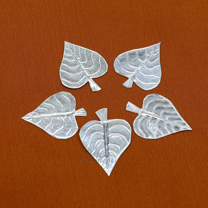 Set of 5 handmade 925 sterling silver pipal leaf puja articles by TribalOrnaments, detailed silver religious ornaments for worship.