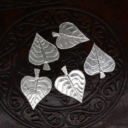 Set of 5 handmade 925 sterling silver pipal leaf puja articles by TribalOrnaments, detailed silver religious ornaments for worship.
